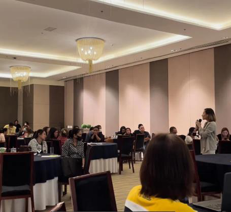 A ballroom audience at a financial planning session